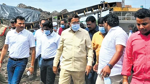 Municipal Administration and Urban Development Minister P Narayana inspects the Allipuram dumping yard in Nellore city on Sunday.