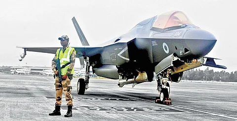 A CISF official guarding the UK F-35 B stealth fighter, grounded at Thiruvananthapuram airport