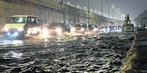 Waterlogging at Vinod Nagar causes traffic snarls after rainfall.