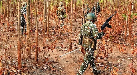 Police recovered AK-47 rifles, ammunition, kit bags, cash, Maoist literature, and clothing.