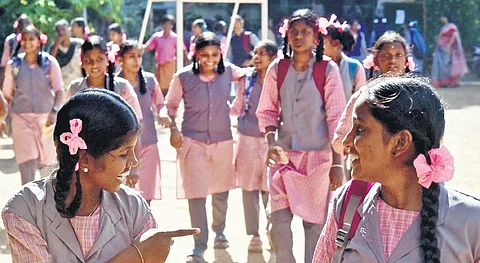 Students of Perunthalaivar Kamarajar Govt. Girls Hr. Sec. School, Ambattur, return to the school after the summer holidays, on the first day of academic year, commences on Monday in Chennai.