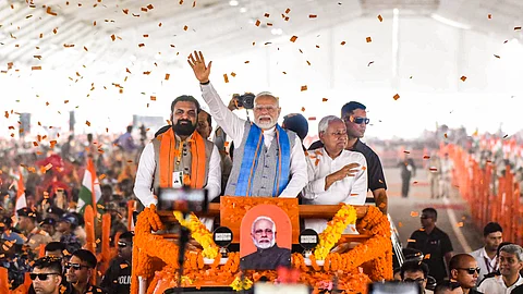 Prime Minister Narendra Modi, Bihar Chief Minister Nitish Kumar and Deputy CM Samrat Choudhary arrive during a public meeting, in Siwan district, Friday, June 20, 2025