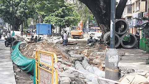 This CBD area is in a shambles and businesses are hit after BWSSB dug up the roadside to replace a sewage pipe.