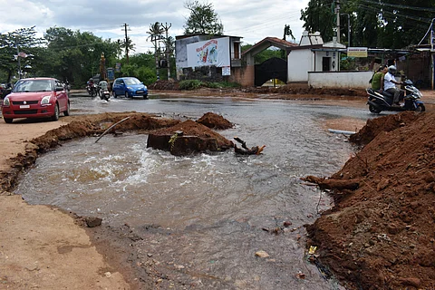 Water gushes out from a broken drinking water pipeline at Kalampalayam on Siruvani Main Road in Coimbatore district, after it was damaged during excavation work for road expansion by the Highways Department on Friday.