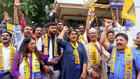 Aam Aadmi Party (AAP) workers shout slogans and celebrate after Gopal Italiya's victory over BJP in the Visavadar Assembly by-election, at the party office, in Ahmedabad, Monday, June 23, 2025.