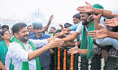 Chief Minister A Revanth Reddy greets the public after attending the Rythu Bharosa Vijayotsava Sabha programme near the Secretariat in Hyderabad on Tuesday