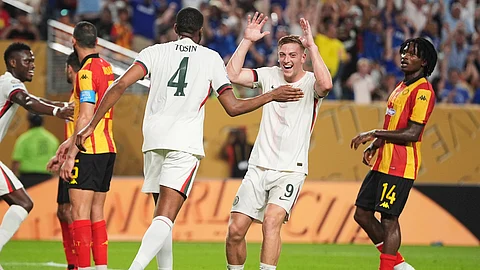 Chelsea's Tosin Adarabioyo, left, is congratulated by teammate Liam Delap after scoring his team's first goal during the Club World Cup Group D soccer match between Esperance Tunisie and Chelsea in Philadelphia, Tuesday, June 24, 2025.