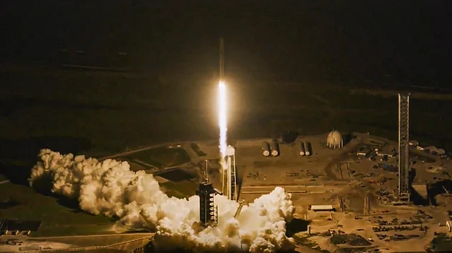 SpaceX Falcon 9 rocket with the Crew Dragon capsule lifts off.