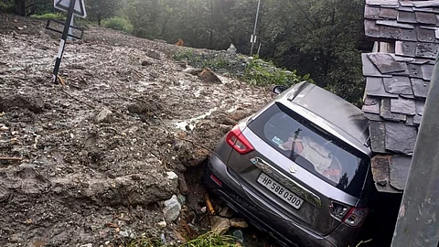 A damaged vehicle after being swept away in flash floods due to cloudbursts, in Kullu district, Himachal Pradesh, Wednesday, June 25, 2025.