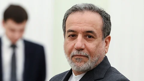 Iranian Foreign Minister Abbas Araghchi stands waiting to meet Russian President Vladimir Putin for the talks at the Kremlin in Moscow, Russia, Monday, June 23, 2025.