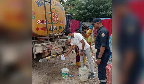 HYDRAA officials collect samples to check the quality of water from Sunnam Cheruvu