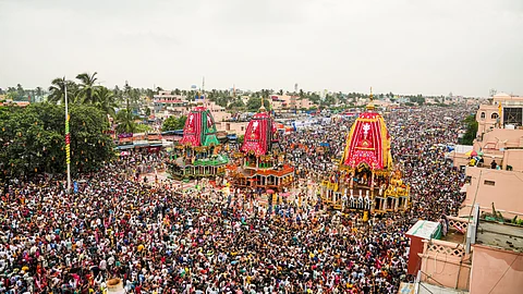The volunteers formed a human chain, carving out a dedicated ambulance corridor through dense crowd, to provide prompt medical care during the chariot festival.