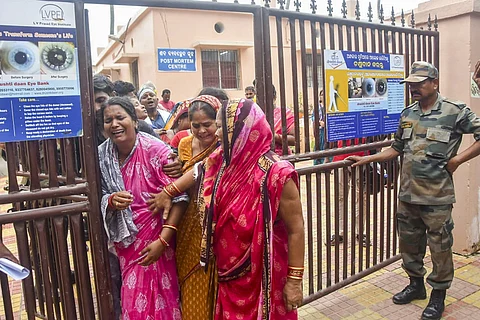 Family members of a victim mourn at a hospital after a stampede near Shree Gundicha Temple in Puri, Odisha