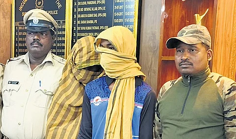 Police with the two accused: Atul Prasad Dalbehera (25) and his cousin Biswabhanu Pradhan (27).