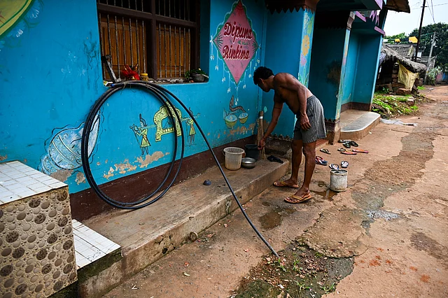 Underground pipelines laid for water supply kept outside a house in Suanri village for a year as an overhead water tank is yet to be constructed.