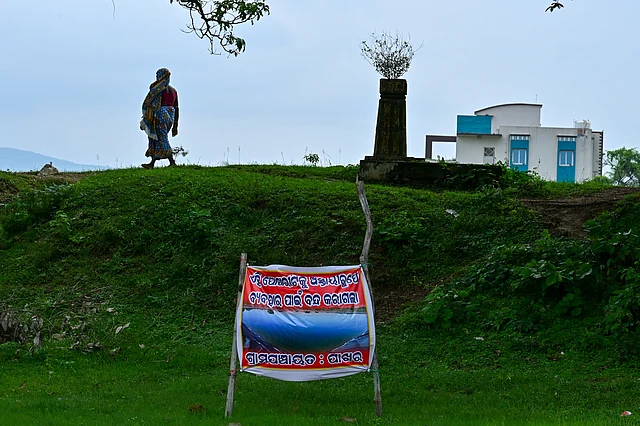 A poster put up by district authorities banning use of a pond in Pakhara village.