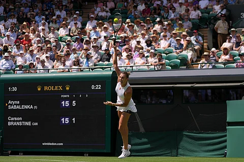 Aryna Sabalenka of Belarus serves the ball to Carson Branstine of Canada during their first round women's single match at the Wimbledon Tennis Championships in London, Monday, June 30, 2025.