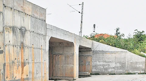 The nearly complete road under bridge in Babusapalya remains inoperational owing to a land dispute.