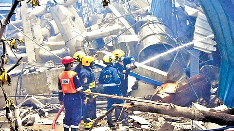 Firefighters dousing flames inside the Sigachi Industries factory.