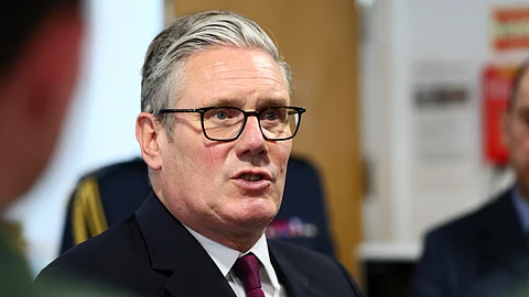 Britain's Prime Minister Keir Starmer speaks with trainee pilots during a visit to RAF Valley, Anglesey, north Wales, Friday June 27, 2025.