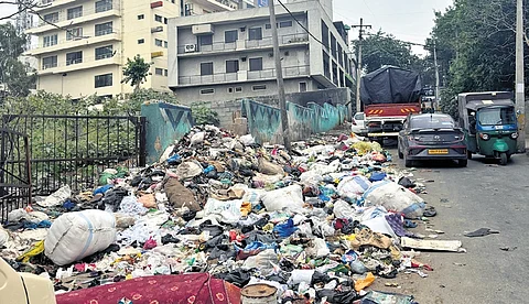 Garbage dumped near a vacant plot at Guddadahalli.