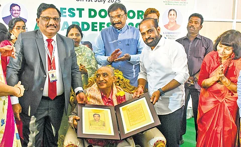 Health Minister Y Satya Kumar Yadav felicitates a senior doctor on the occasion of National Doctor’s Day at NTR Health University in Vijayawada