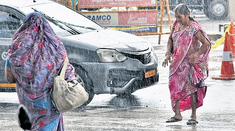 A brief shower brought down the temperature but caught commuters unawares at Egmore on Wednesday