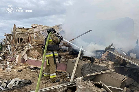 In this photo provided by the Ukrainian Emergency Service, emergency services personnel work to extinguish a fire following a Russian attack in Donetsk region, Ukraine, Wednesday, July 2, 2025.