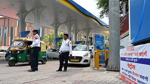 Traffic Police personnel keep a vigil at a petrol pump after fuel ban for end-of-life (EoL) vehicles under the directions of Commission for Air Quality Management (CAQM), in New Delhi on Tuesday, July 1, 2025.