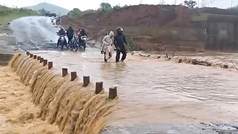 Rainwater flowing over Bangalaguda bridge on Wednesday