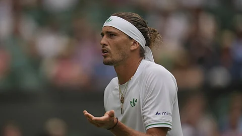 Alexander Zverev of Germany reacts as he plays Arthur Rinderknech of France during their first round men's singles match at the Wimbledon Tennis Championships in London, Tuesday, July 1, 2025.