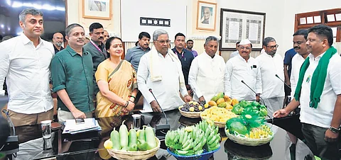 Chief Minister Siddaramaiah, ministers and top officials with farmers from Devanahalli and surrounding villages during a meeting in Bengaluru on Friday