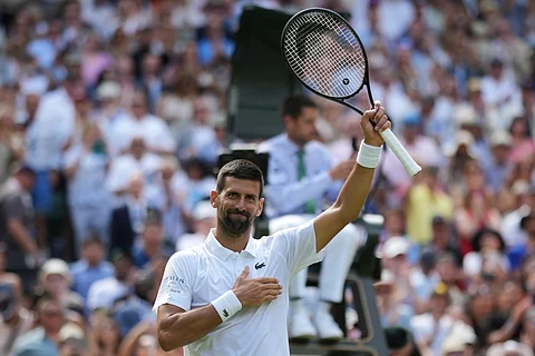 Novak Djokovic of Serbia reacts after beating Daniel Evans of Britain during their second round men's singles match at the Wimbledon Tennis Championships in London, Thursday, July 3, 2025.