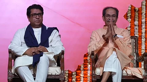Shiv Sena (UBT) chief Uddhav Thackeray shares the stage with cousin and MNS chief Raj Thackeray at a rally in Mumbai on Saturday, July 5, 2025.