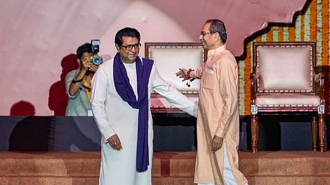 Maharashtra Navnirman Sena (MNS) chief Raj Thackeray, left, and Shiv Sena (UBT) chief Uddhav Thackeray during a joint victory rally, titled 'Awaj Marathicha', organised by the cousins, at Worli area, in Mumbai, Maharashtra, Saturday, July 5, 2025.