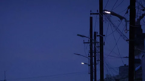 Dim streetlights in Madurai.