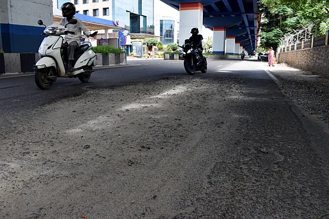 Damaged roads near Sungam bus stop on Tiruchy road in Coimbatore city.