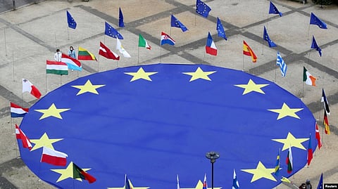 The European Commission proposed two EU laws that would require the 27 member states . (Reuters via VOA)