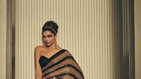 The sari, which the actress and Cannes jury member paired with a black strapless blouse. (IANS)