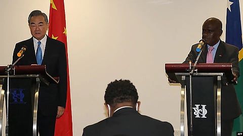 Chinese Foreign Minister Wang Yi and his counterpart from the Solomon Islands, Jeremiah Manele, attend a press conference in Honiara, May 26, 2022. China has "no intention at all" to build a military base in the Solomons, Wang said.