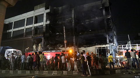 Police broke the windows of the building to help rescue those inside. (Reuters via VOA)