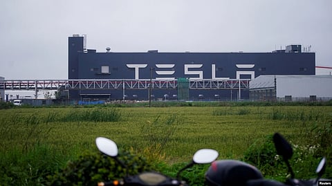 Tesla signage is seen at its factory in Shanghai, China, May 13, 2021. (Reuters via VOA)