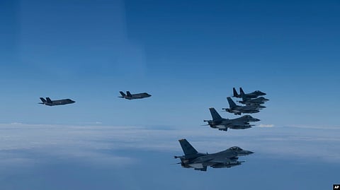 U.S. and South Korea Air Force fighter jets fly in formation during a joint drill on June, 7, 2022. The South Korean and U.S. militaries flew 20 fighter jets over South Korea's western sea.