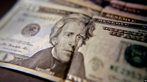 U.S. household income fell for the first time in two years, mostly due to declines in the stock market. This June 13, 2018, photo shows U.S. currency.