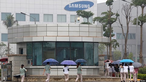 Employees make their way to work at the Samsung factory in Thai Nguyen province, north of Hanoi, Vietnam, Oct. 13, 2016.