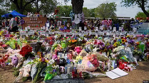 Flowers, toys, and other objects to remember the victims of the deadliest U.S. school mass shooting in nearly a decade, resulting in the death of 19 children and two teachers, are pictured at the Robb Elementary School in Uvalde, Texas.
