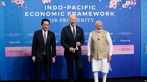 From left, Japanese Prime Minister Fumio Kishida, U.S. President Joe Biden and Indian Prime Minister Narendra Modi pose for photos as they arrive at the Indo-Pacific Economic Framework for Prosperity launch event at the Izumi Garden Gallery in Tok.