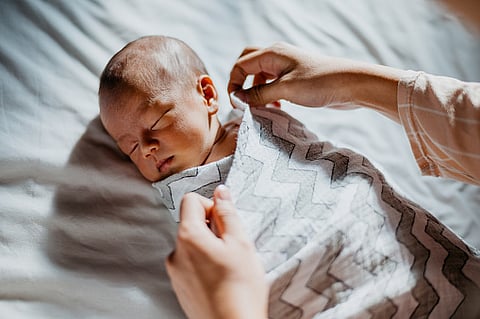 Infants born from infected mothers tend to show greater difficulty. (Unsplash)