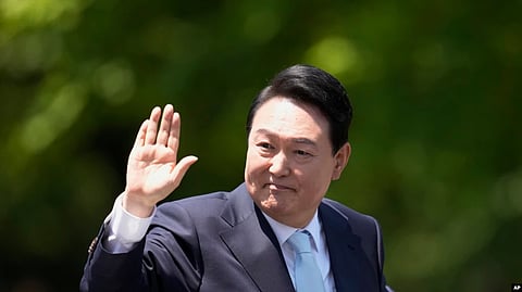 South Korea's new President Yoon Suk Yeol waves from a car after the Presidential Inauguration outside the National Assembly in Seoul, South Korea, May 10, 2022. This week, he will represent South Korea at the NATO summit in Madrid.