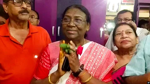 India's governing Bharatiya Janata Party's presidential candidate Draupadi Murmu greets well-wishers who called on her at Raigangpur in Odisha, India, June 22, 2022.